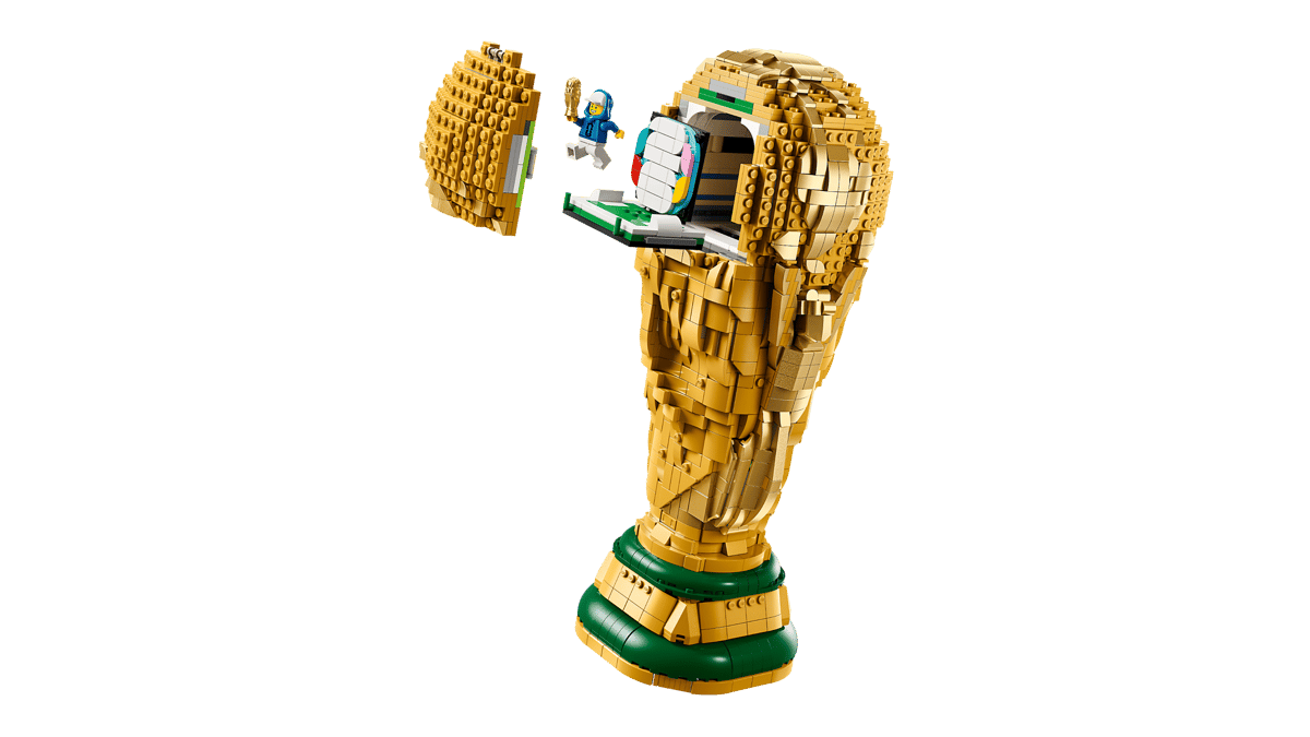lego statue, golden trophy, hand sculpture, tower base, mini figure